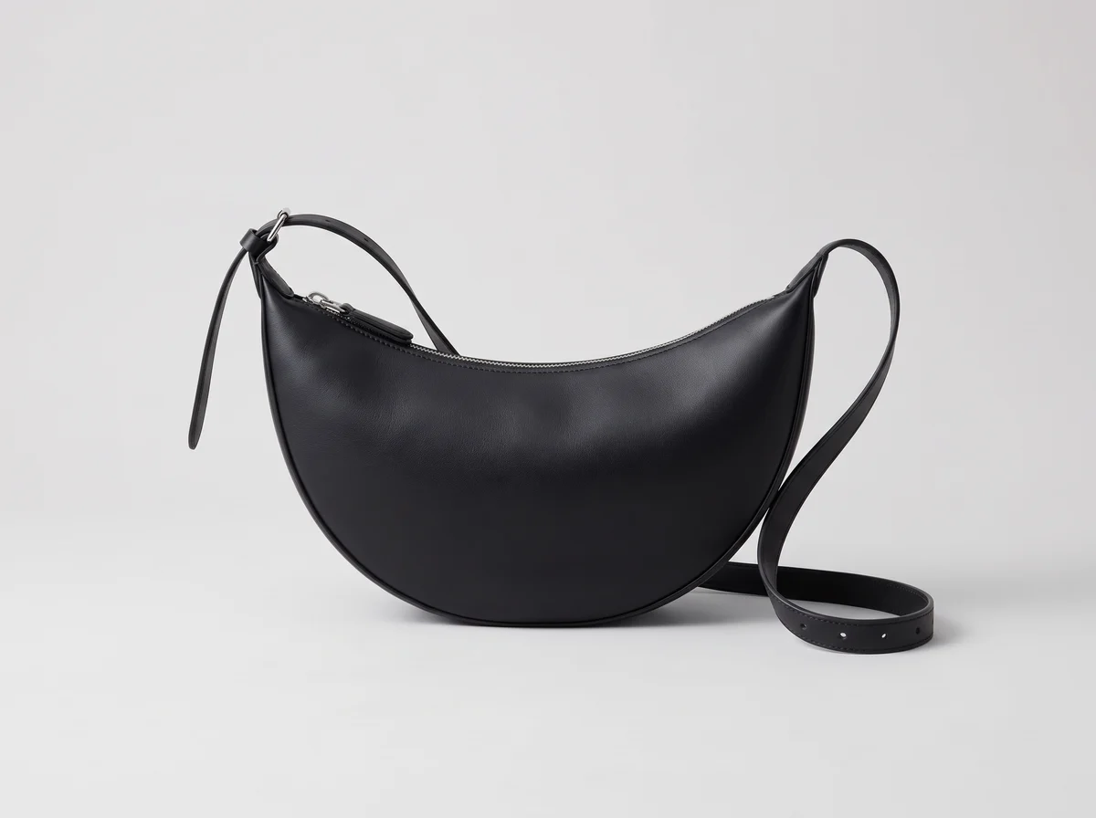 An illustration of a black crescent bag
